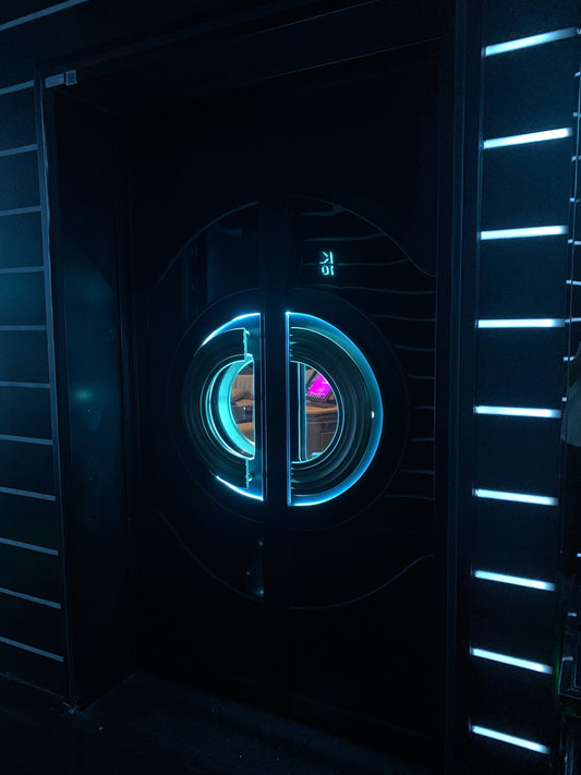 Double soundproof fire-resistant door with glowing circular LED lights, installed in a sleek, modern hallway for home or commercial space