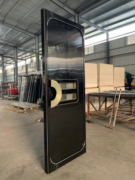 A sleek, black fire-resistant soundproof door with an elegant gold accent and curved detailing, designed for modern commercial interiors.