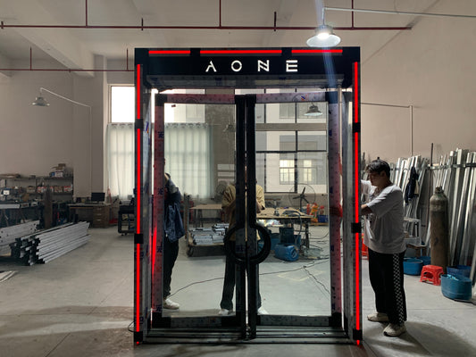 Architectural soundproof and fire-rated glass door under installation, combining safety, LED lighting, and modern design aesthetics.