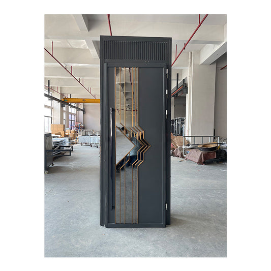 Modern stainless steel soundproof door with golden accents installed in a spacious environment