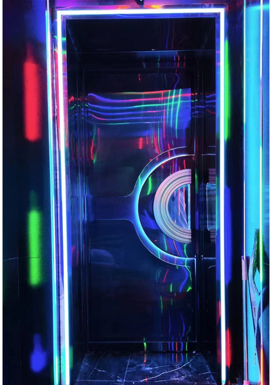 High-gloss acoustic door with reflective LED lighting, representing advanced sound isolation in modern entertainment rooms