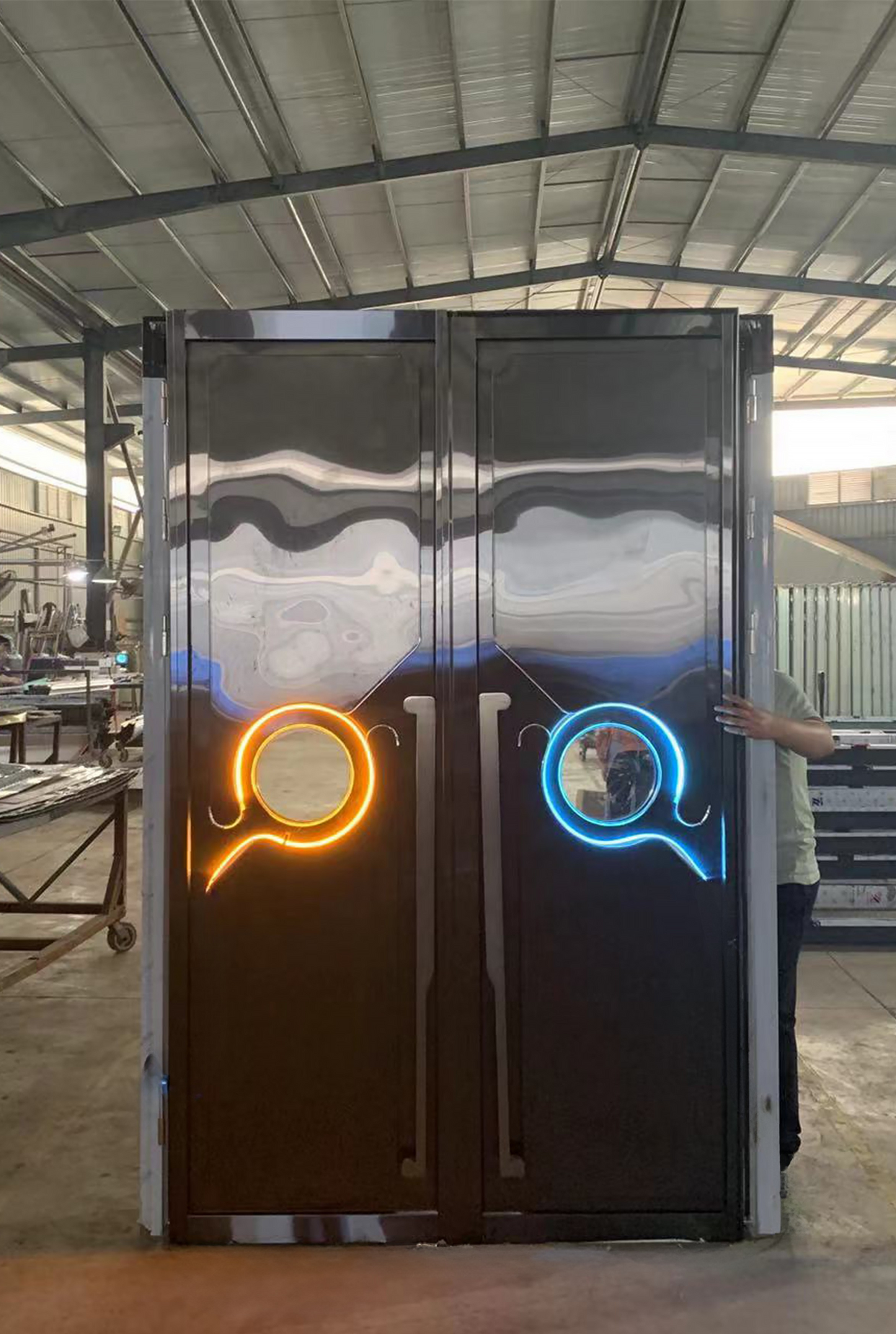 Double stainless steel LED soundproof door with mirrored finish and dual circular LED lights in orange and blue – designed for KTV or club settings