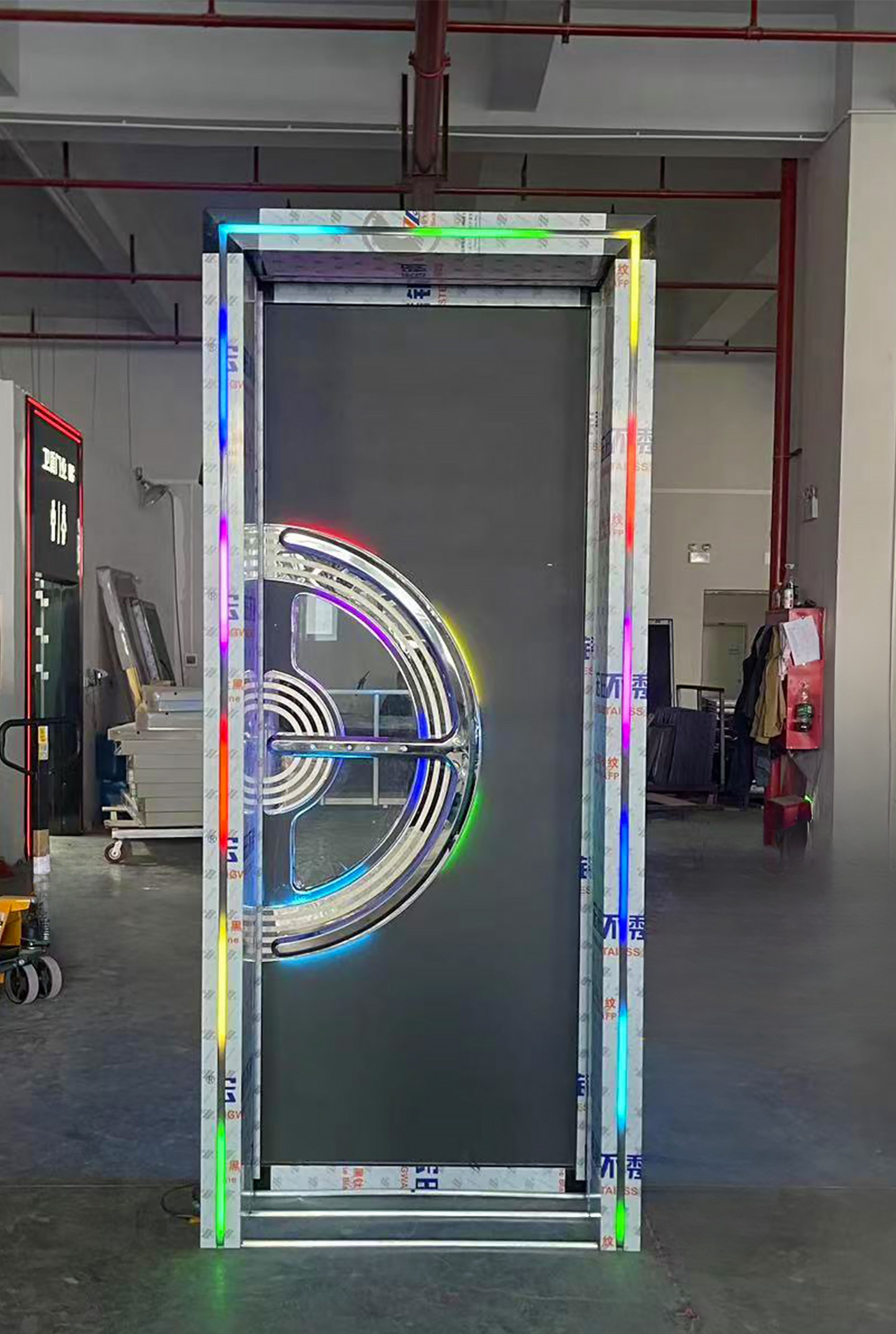 Soundproof door with matte black finish, rainbow LED ring design, and stainless steel accents – perfect for colourful KTV or club entrances
