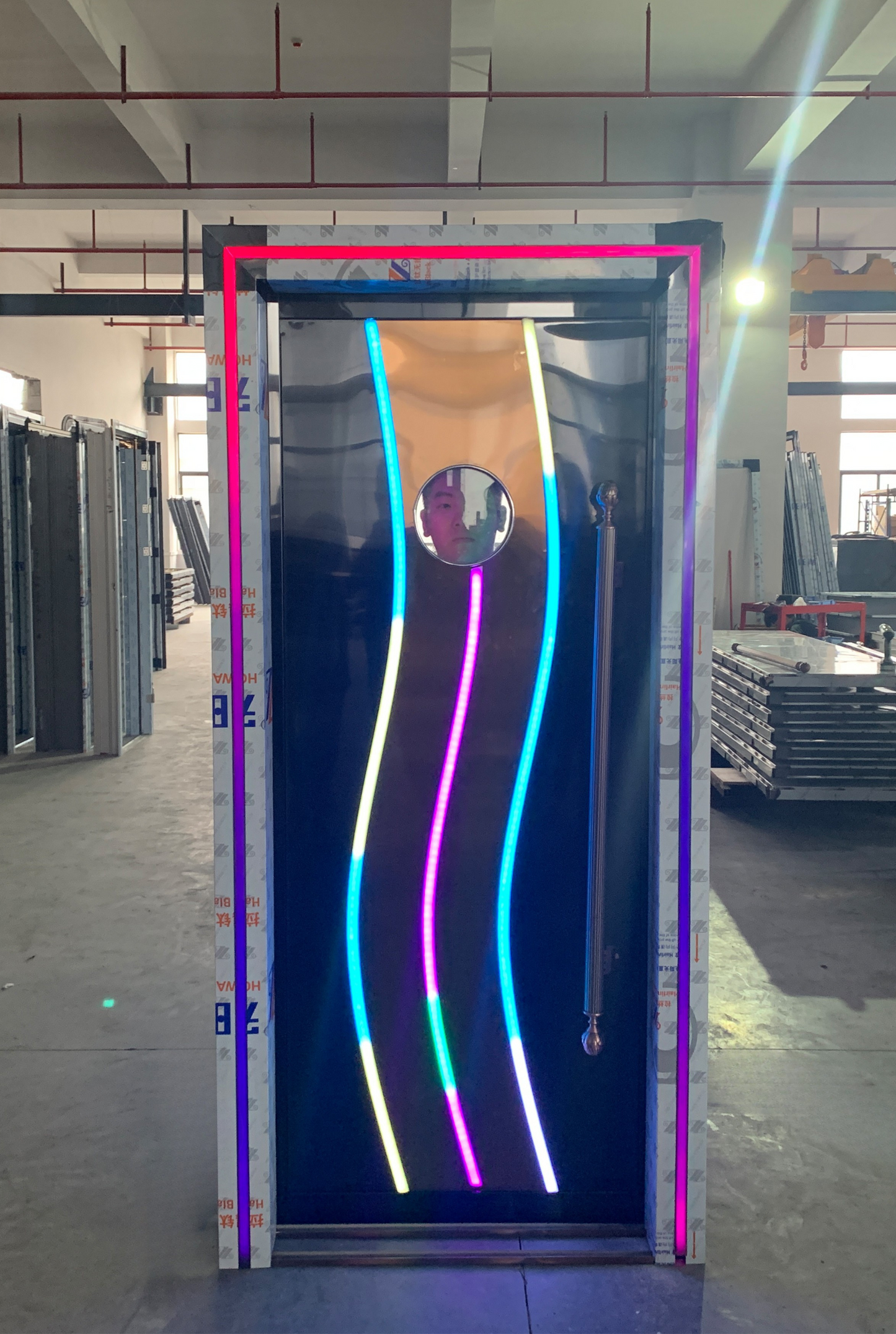 Black stainless steel soundproof door with three colourful wave LED strips and a round viewing window – ideal for clubs or gaming lounges