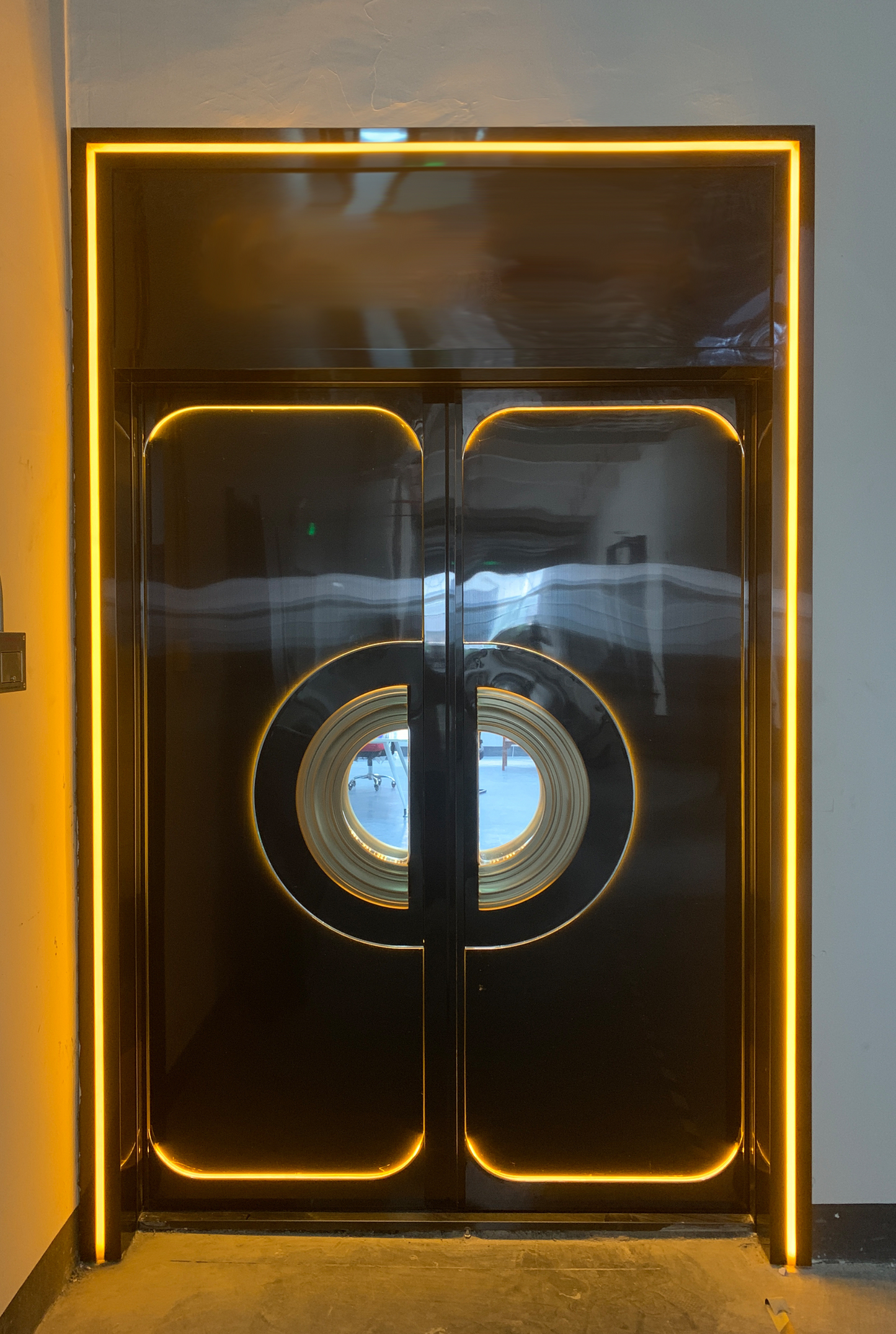 Luxury black stainless steel double soundproof door with gold amber LED lighting and round windows – ideal for private clubs or high-end lounges