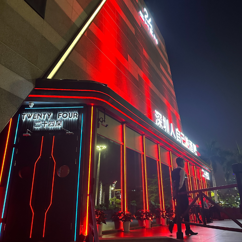 Shenzhen karaoke club featuring a soundproof door with red and blue lighting.