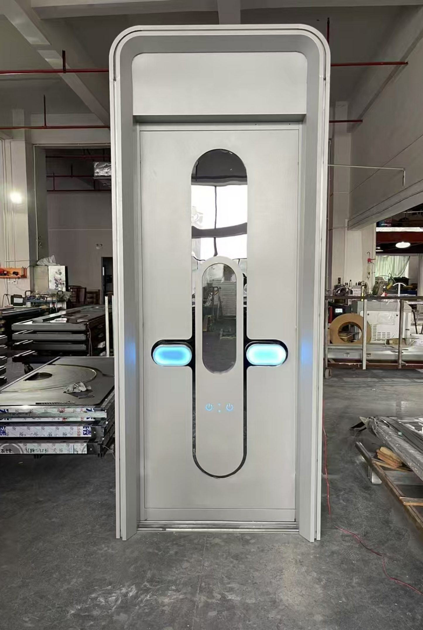 White stainless steel LED soundproof door with oval window, blue light accents, and minimalistic design – suitable for modern clubs or futuristic spaces