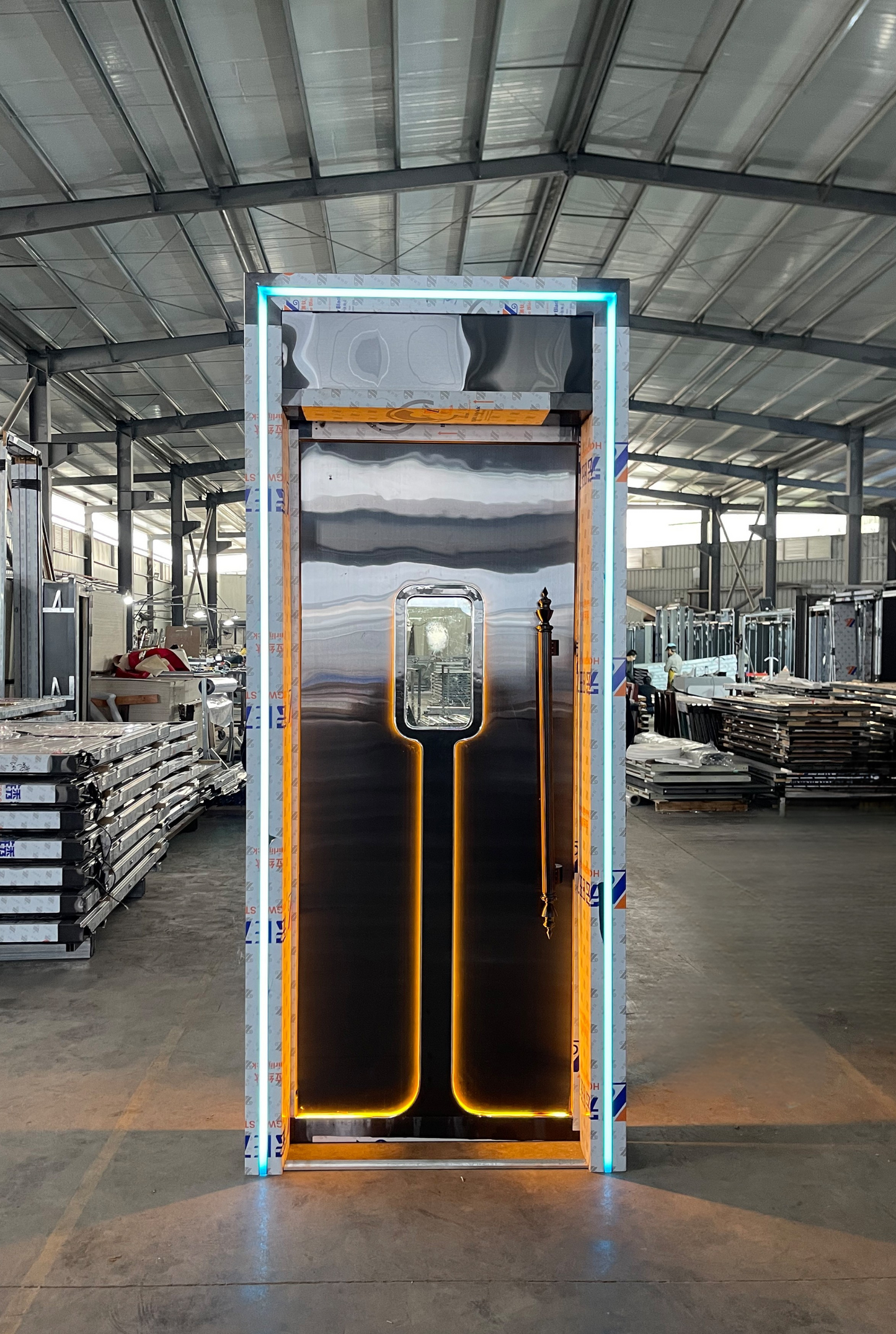 Stainless steel LED soundproof door with warm amber vertical lighting, slim window, and vintage-style handle – ideal for clubs or private spaces