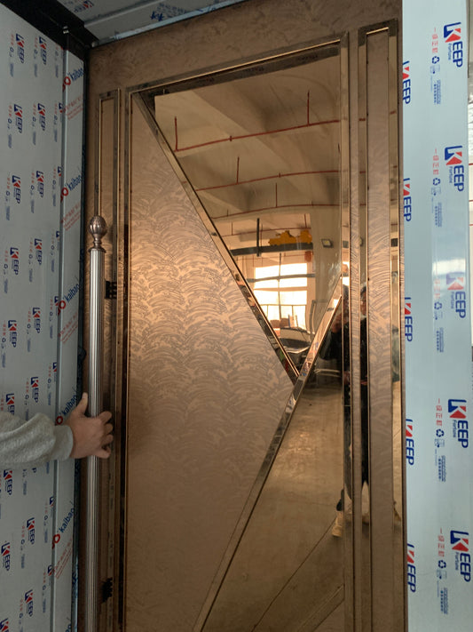 Elegant soundproof door with a sleek metal finish and artistic design, perfect for high-end commercial or residential spaces, providing both style and functionality.